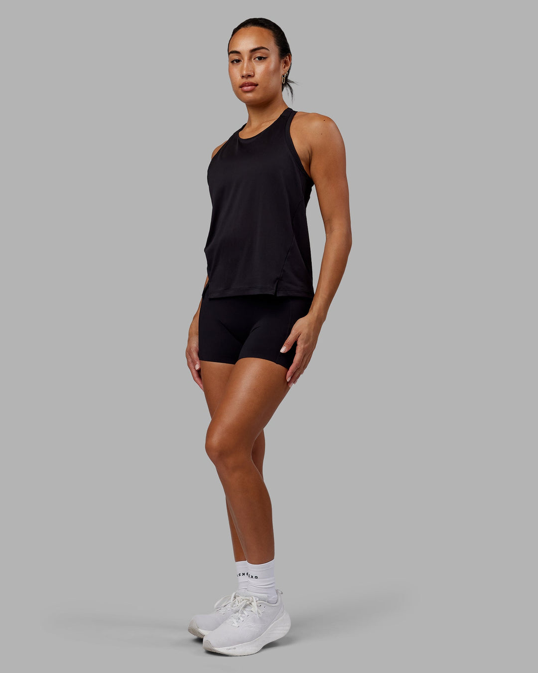 Woman wearing Pace Running Tank - Black