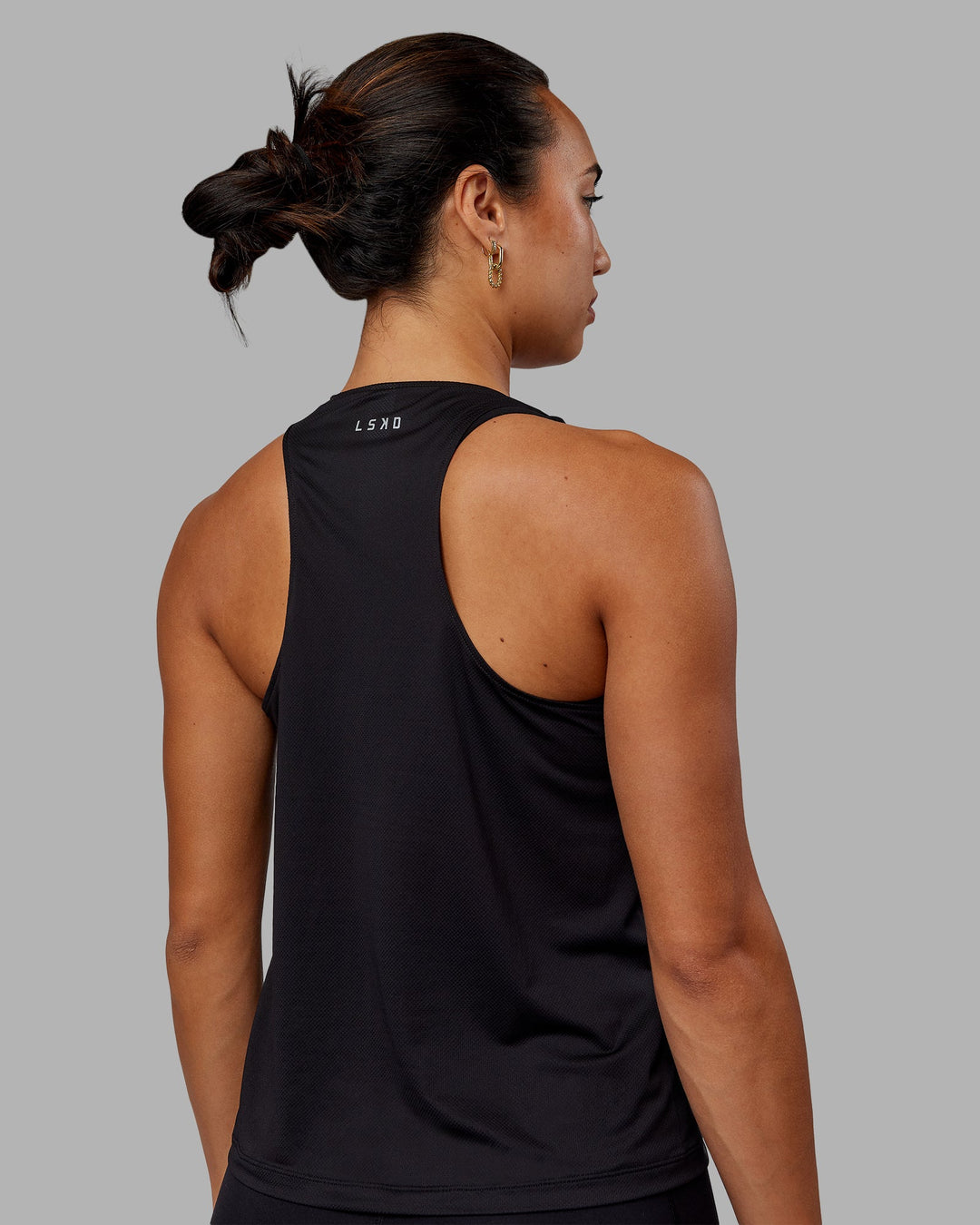 Woman wearing Pace Running Tank - Black