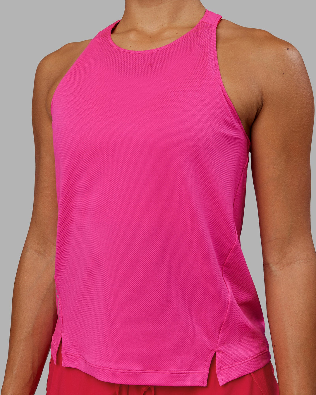 Woman wearing Pace Running Tank - Ultra Pink