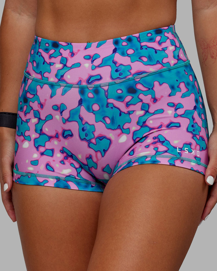 Woman wearing RXD Micro Shorts - Neon Camo
