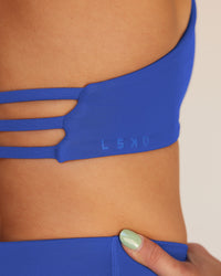 Woman wearing Abs Agile Halter Sports Bra - Power Cobalt | Model:Abbey | Size:S