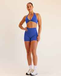 Woman wearing Abs Fusion High-Rise 4" Short Pockets - Power Cobalt | Model:Abbey | Size:S