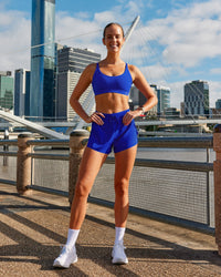 Woman wearing Accelerate 3" High-Rise Running Short - Electric Indigo | Model:Zara | Size:S