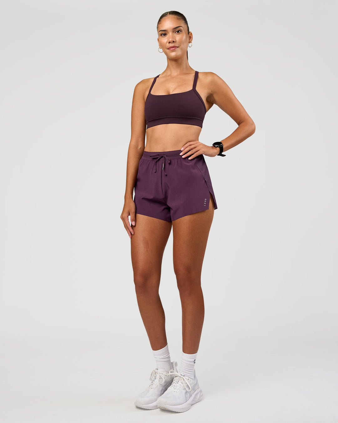 Woman wearing Accelerate 3" High-Rise Running Short - Midnight Plum | Model:Rhiley | Size:S