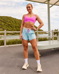 Woman wearing Accelerate 3" High-Rise Running Short - Taupe Ash-Glacial Blue | Model:Ella | Size:S