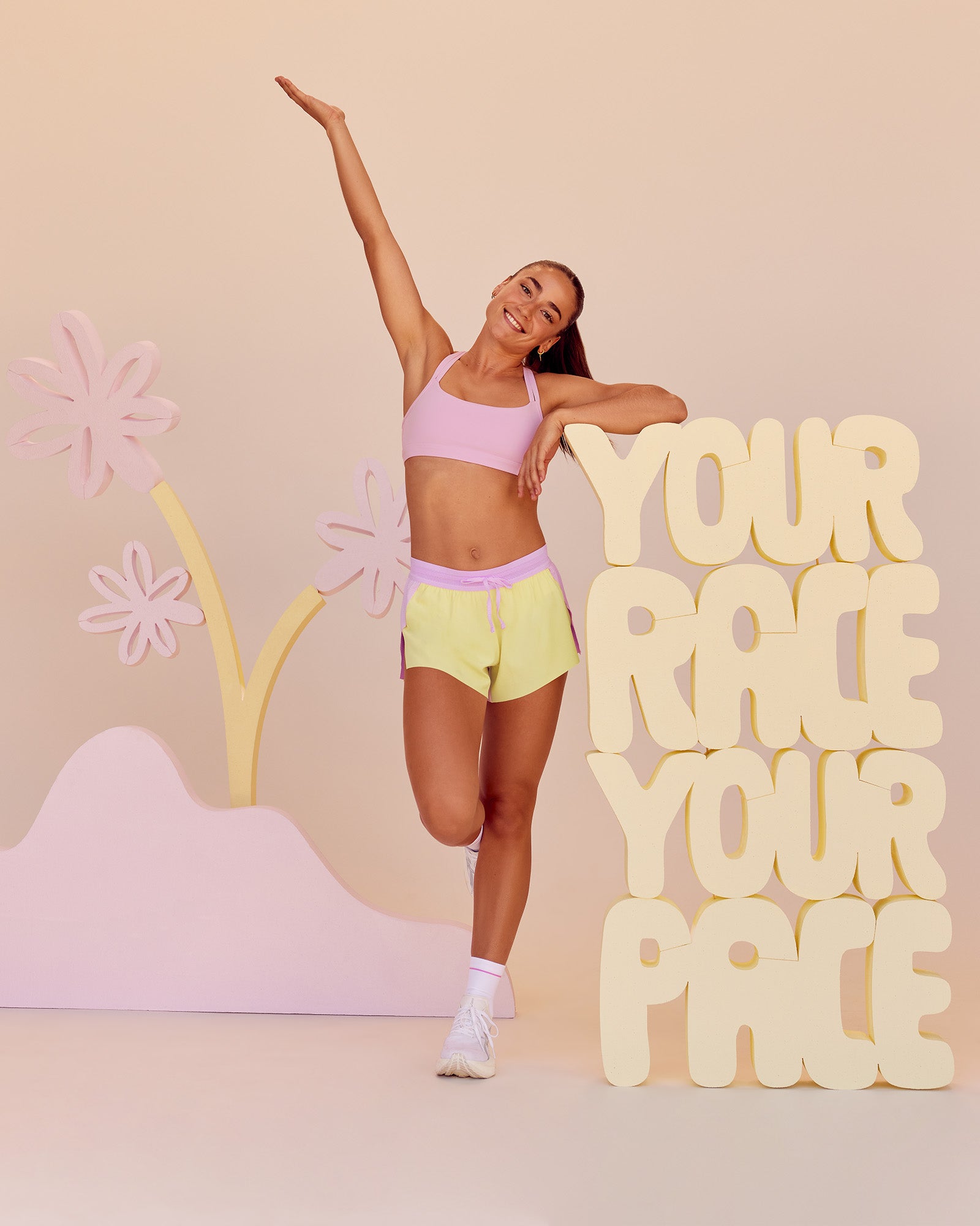 Woman wearing Accelerate 3" Mid-Rise Running Short - Marshmallow-Lemon | Model:Grace | Size:S