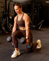 Woman wearing Accelerate Sports Bra - Hot Chocolate | Model:Te | Size:S