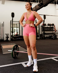Woman wearing Agile Sports Bra - Pink Lemonade | Model:Charlotte | Size:S