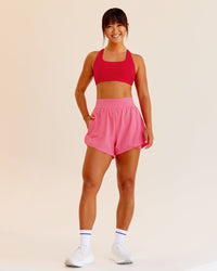 Woman wearing Challenger 3" Lined Performance Shorts in Pink Lemonade | Size:S