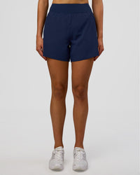 Woman wearing Challenger 5" Lined Performance Short - Future Navy | Model: Evie | Size:S