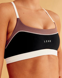 Man wearing Elevate Sports Bra - Black-Multi | Model:Charlize | Size:S