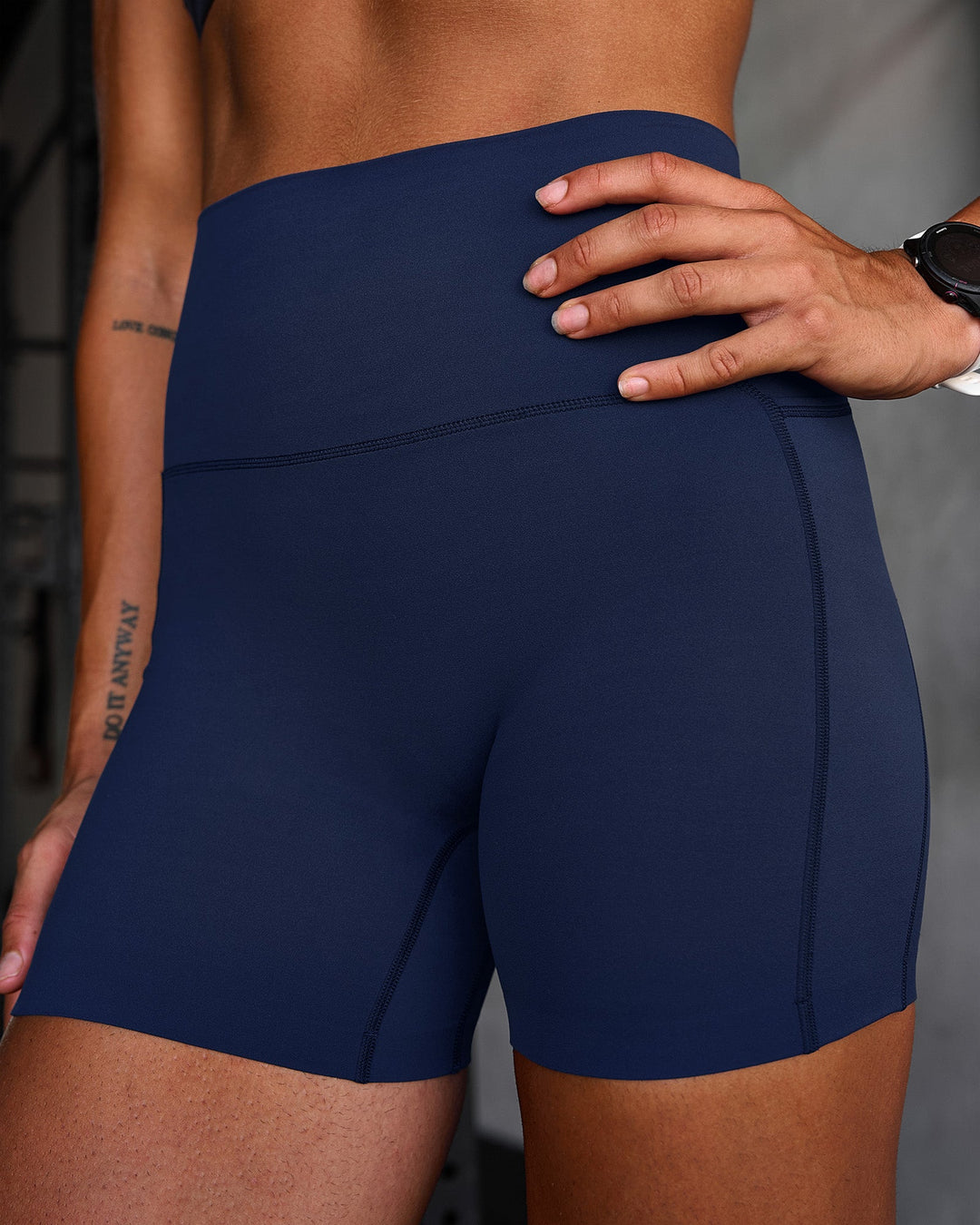 Woman wearing Elixir Ultra High-Rise 4" Short Pockets - Future Navy | Model:Chyna | Size:S