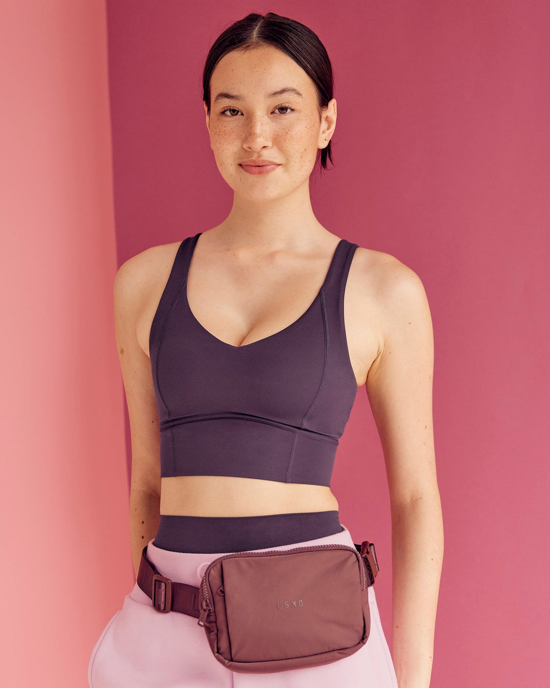 Woman wearing Function Longline Sports Bra - Midnight Plum | Model:Paradise | Size:S