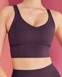 Woman wearing Function Longline Sports Bra - Midnight Plum | Model:Paradise | Size:S
