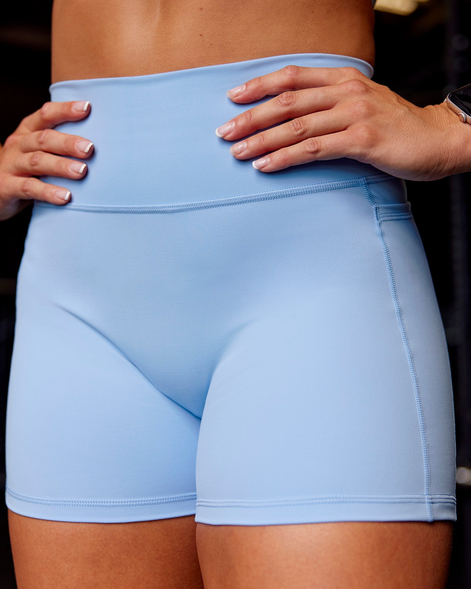 Woman wearing Fusion Ultra High-Rise 4" Short Pockets - Open Air | Model:Paris | Size:S