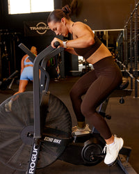 Woman wearing Fusion Ultra High-Rise 7/8 Legging Pockets - Hot Chocolate | Model:Te | Size:S