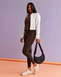 Woman wearing Fusion Ultra High-Rise Full Length Legging Pockets - Hot Chocolate | Model:Nikki | Size:S