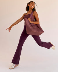 Woman wearing Fusion V-Contour High-Rise Flared Legging Pockets - Cherry Lacquer | Model:Jordan | Size:S