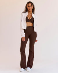 Woman wearing Woman wearing Fusion V-Contour High-Rise Flared Legging Pockets - Hot Chocolate | Model:Jordan | Size:S