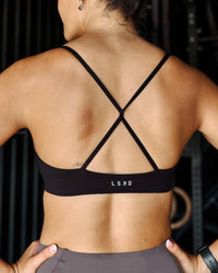 Woman wearing Infinite Contour Sports Bra - Black | Model:Stella | Size:S