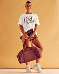 Woman wearing LSKD Fitness Club Heavyweight Oversized Tee - Off White-Cocoa Powder | Model:Charlize | Size:S