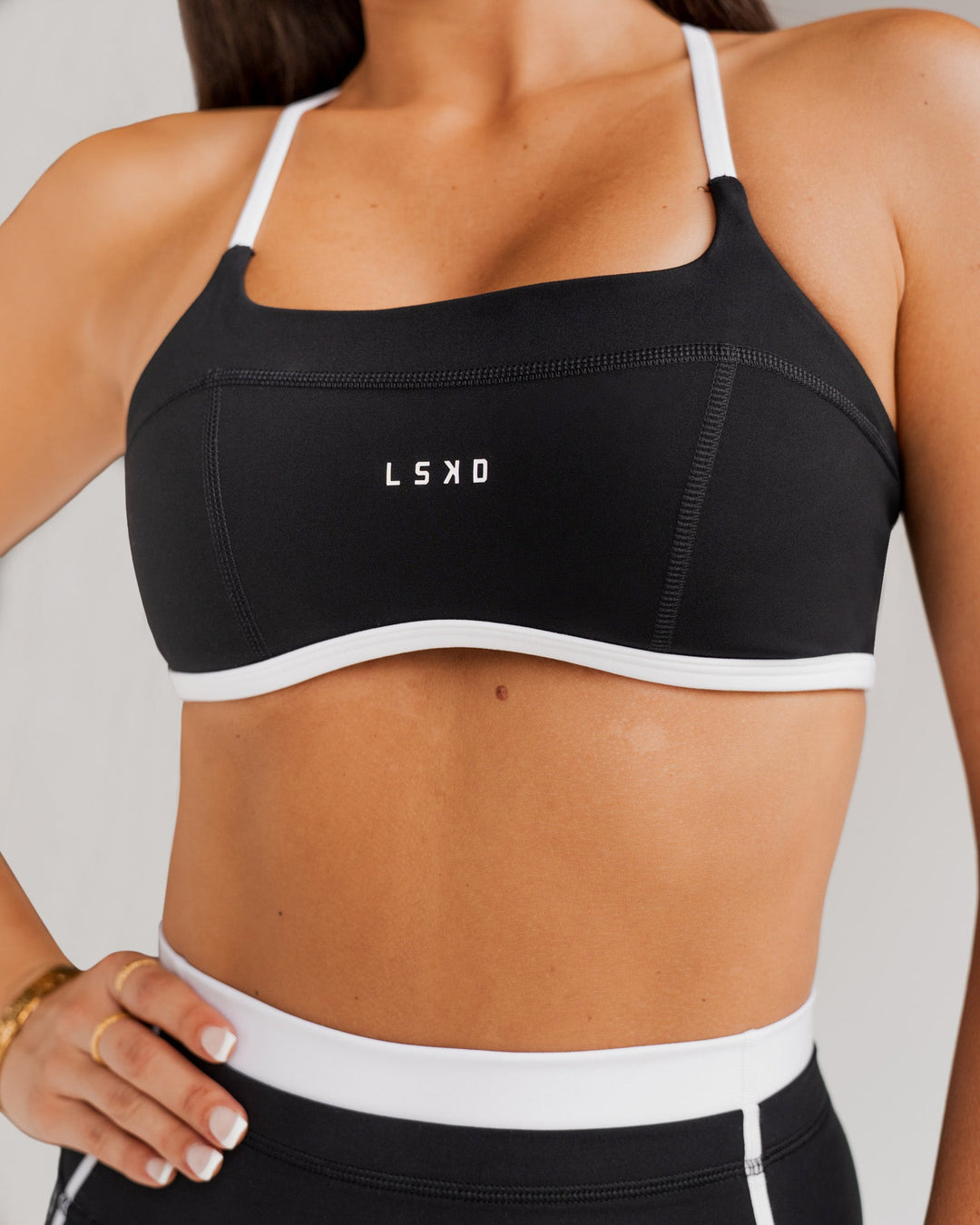 Woman wearing Liberate Sports Bra - Black-White | Model:Bianca | Size:S