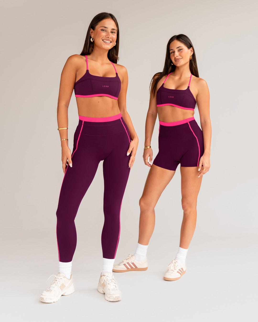 Woman wearing Liberate Sports Bra - Plum Caspia-Ultra Pink | Model:Both | Size:S