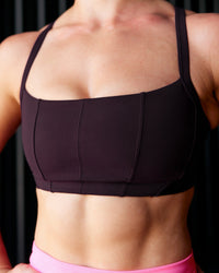 Woman wearing Momentum Corset Sports Bra - Midnight Plum | Model:Te | Size:S