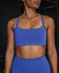 Woman wearing Momentum Sports Bra - Power Cobalt | Model:Vanessa | Size:S
