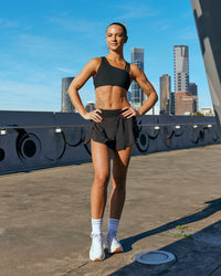 Woman wearing Pacer 3" Run Short - Black | Model:Nina | Size:S