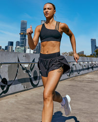 Woman wearing Pacer 3" Run Short - Black | Model:Nina | Size:S