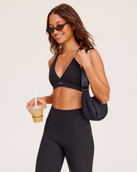 Woman wearing Stamina Sports Bra - Black | Model:Dakota | Size:S