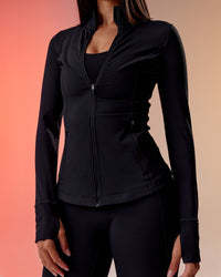 Woman wearing Stride Thermal Zip Through Jacket - Black | Model:Rhiley | Size:S