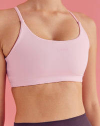 Woman wearing Twist Sports Bra - Marshmallow | Model:Paradise | Size:S