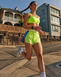 Woman wearing Velocity Sports Bra - Lime Glo | Model:Jasynta | Size:S