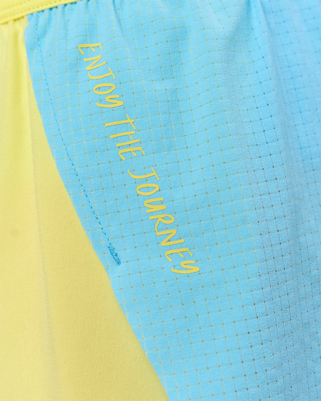 Woman wearing GG Accelerate 3" Mid-Rise Running Short - Baltic Sea-Lemon | Model:Grace | Size:S