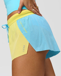 Woman wearing GG Accelerate 3" Mid-Rise Running Short - Baltic Sea-Lemon | Model:Grace | Size:S