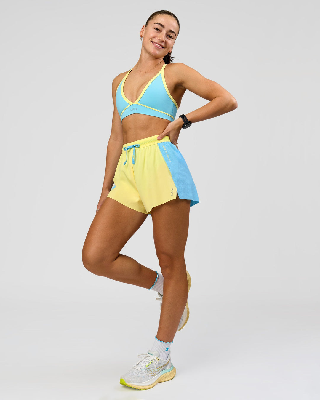 Woman wearing GG Accelerate 3" High-Rise Running Short - Baltic Sea-Lemon | Model:Grace | Size:S