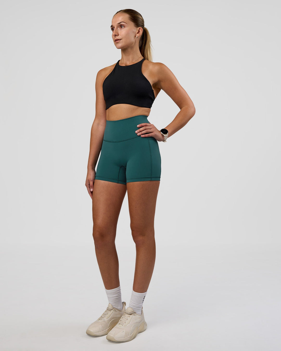 Woman wearing AMRAP High Neck Sports Bra - Black | Model:Myrte | Size:S