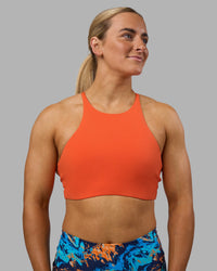 Woman wearing AMRAP High Neck Sports Bra - Ultra Orange | Model:Georgia | Size:S