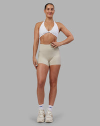 Woman wearing Abs Agile Halter Sports Bra - White | Model:Abbey | Size:S