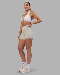 Woman wearing Abs Agile Halter Sports Bra - White | Model:Abbey | Size:S