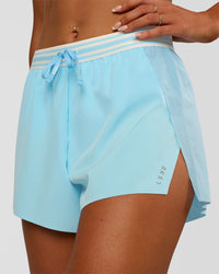 Woman wearing Accelerate 3" High-Rise Running Short - Baltic Sea-Off White | Set:true | Angle:closeup | Model:Emelia | Size:S