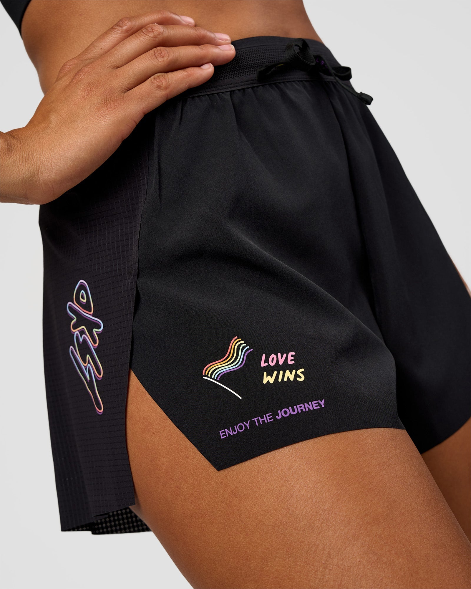 Woman wearing Accelerate 3" High-Rise Running Short - Black-Radiate | Model:Rosie | Size:S