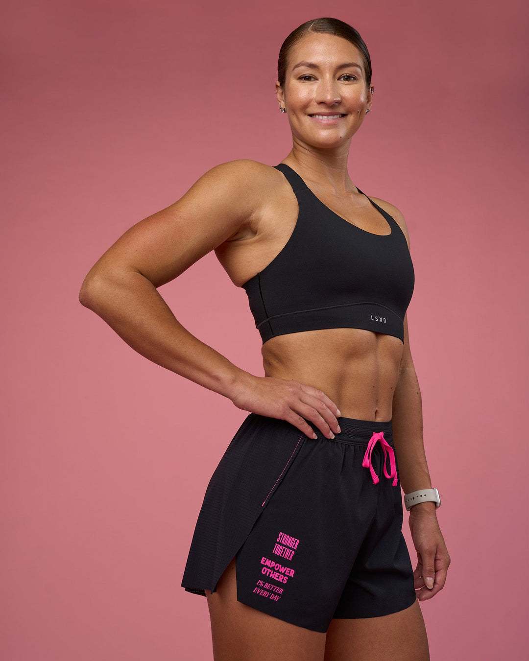 Woman wearing Accelerate 3" High-Rise Running Short - Black-Ultra Pink | Model:Hannah | Size:S