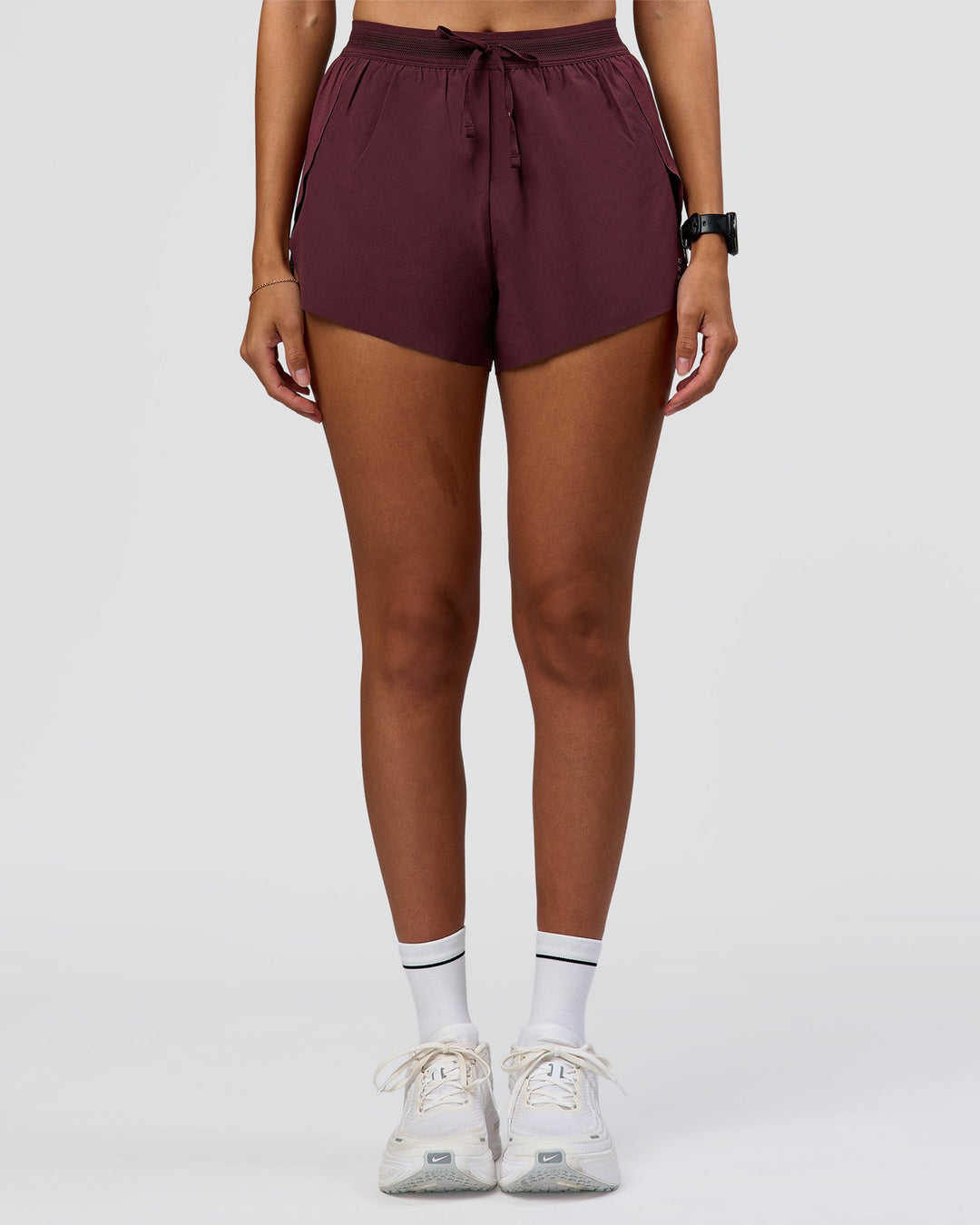 Woman wearing Accelerate 3" High-Rise Running Short - Cherry Lacquer | Model:Rhiley | Size:S - view 4