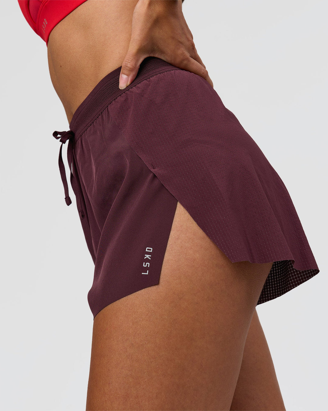 Woman wearing Accelerate 3" High-Rise Running Short - Cherry Lacquer | Model:Rhiley | Size:S - view 3