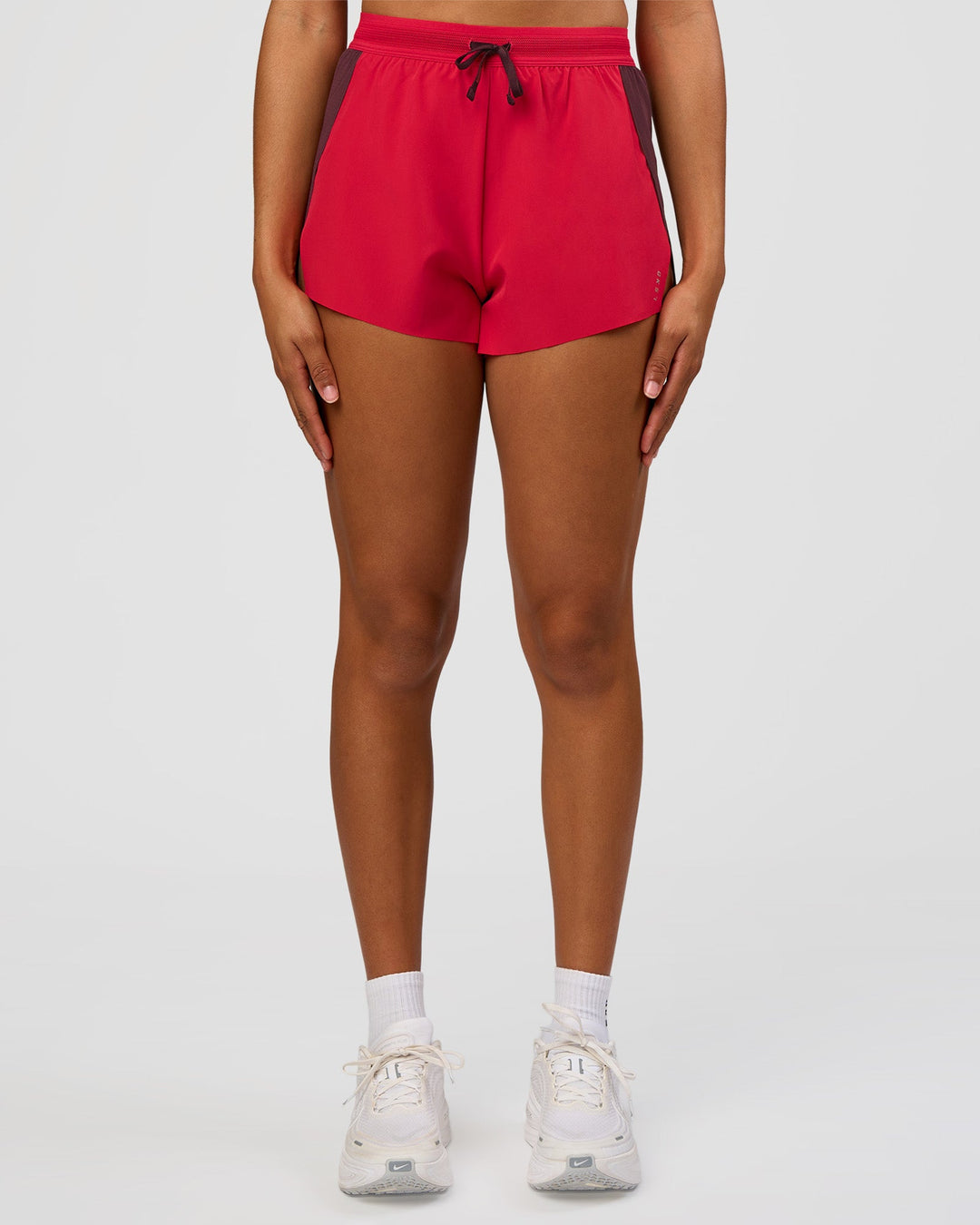 Woman wearing Accelerate 3" High-Rise Running Short - Cherry Lacquer-Scarlet | Model:Rosie | Size:S |