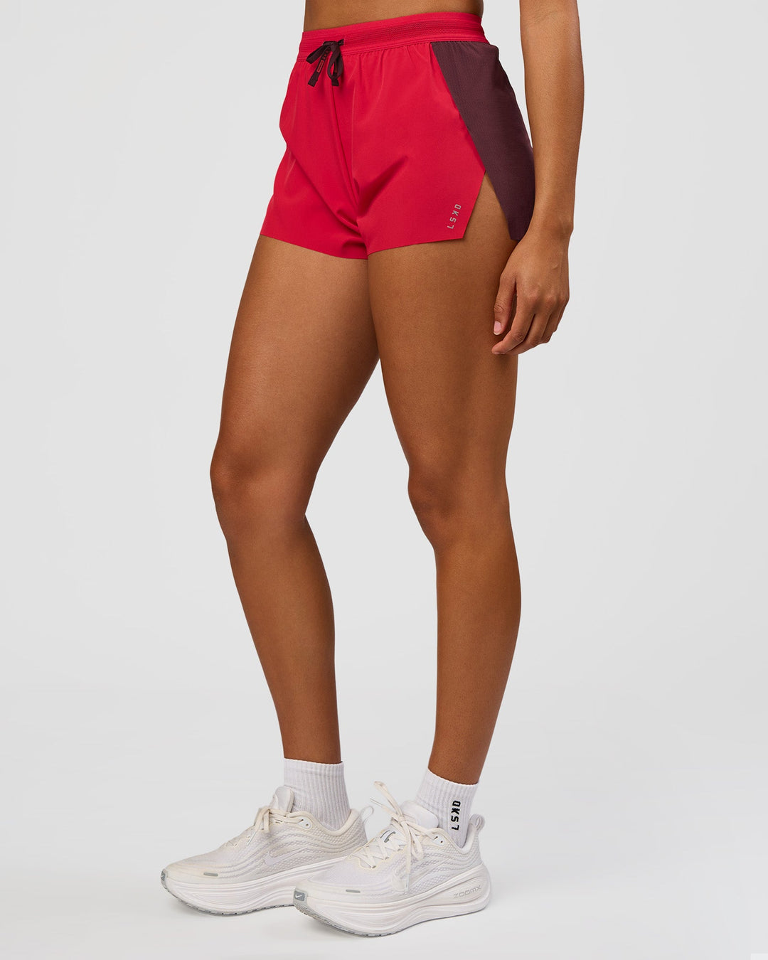 Woman wearing Accelerate 3" High-Rise Running Short - Cherry Lacquer-Scarlet | Model:Rosie | Size:S |