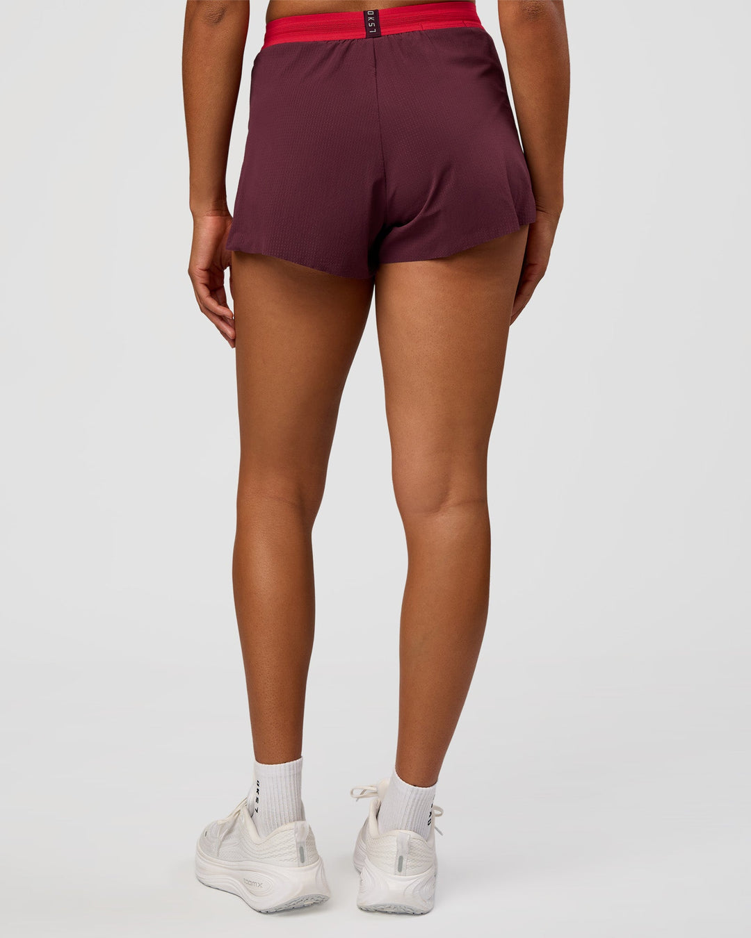 Woman wearing Accelerate 3" High-Rise Running Short - Cherry Lacquer-Scarlet | Model:Rosie | Size:S |